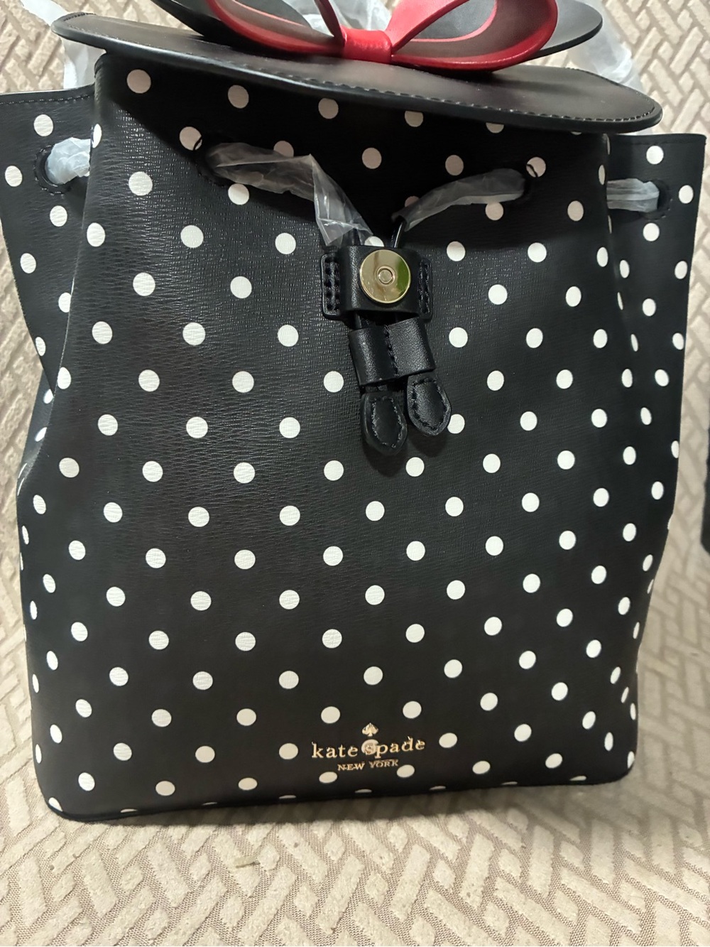 kate spade Black and White Polka Dot Drawstring Backpack with Red Bow Accent